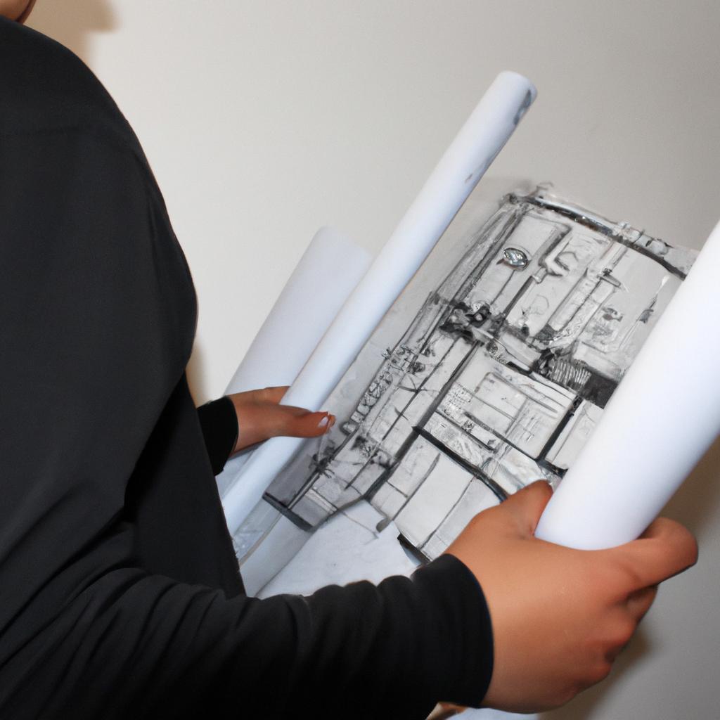 Person holding construction blueprints